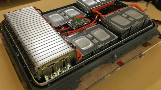 electric car with v shaped battery packs in engine bay